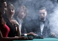 Upper class friends gambling in a casino. Royalty Free Stock Photo