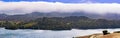 Upper Crystal Springs Reservoir,  part of the San Mateo Creek watershed and Santa Cruz mountains covered with clouds visible in Royalty Free Stock Photo