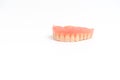 Upper dentures on white background