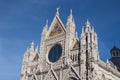 Upper facade detail of Duomo di Siena or Metropolitan Cathedral of Santa Maria Assunta. Tuscany. Italy. Royalty Free Stock Photo