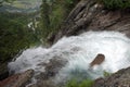 Upper fall flowing towards town of Krimml. Austria Royalty Free Stock Photo