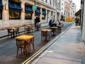 Upper James Street, Restaurant dining chairs and tables outside.