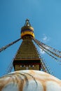 The upper part of the Boudhanath stupa in Kathmandu, Nepal. The image of Buddhas eyes on a gold surface of the stupa. Royalty Free Stock Photo