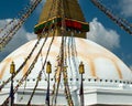 The upper part of the Boudhanath stupa in Kathmandu, Nepal. The image of Buddhas eyes on a gold surface of the stupa. Royalty Free Stock Photo