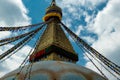 The upper part of the Boudhanath stupa in Kathmandu, Nepal. The image of Buddhas eyes on a gold surface of the stupa. Royalty Free Stock Photo