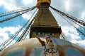 The upper part of the Boudhanath stupa in Kathmandu, Nepal. The image of Buddhas eyes on a gold surface of the stupa. Royalty Free Stock Photo