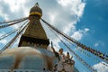 The upper part of the Boudhanath stupa in Kathmandu, Nepal. The image of Buddhas eyes on a gold surface of the stupa. Royalty Free Stock Photo