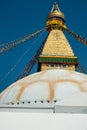 The upper part of the Boudhanath stupa in Kathmandu, Nepal. The image of Buddhas eyes on a gold surface of the stupa. Royalty Free Stock Photo