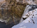 Upper part of famous waterfall SkÃÂ³gafoss, a popular tourist destination in the south of Iceland, in winter with colorful rainbow. Royalty Free Stock Photo