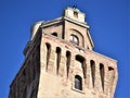 Upper part, illuminated by the sun and surrounded by the blue sky, of the Specola di Padova seat of the ancient astronomical obser