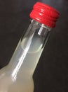 Upper part of a lemonade bottle