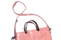 The upper part Is a red women's leather bag of rectangular shape with a long handle over the shoulder.