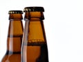 Upper part of two beer bottles