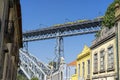 upper platform of the D.Luis bridge between the city of Porto and Vila Nova de Gaia. View from below, group of people and train. Royalty Free Stock Photo