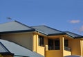 Upper storey of rendered house with metal roof Royalty Free Stock Photo