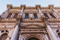 Upper tier of the Scuola Grande di San Marco in Venice, Italy, designed by Pietro Lombardo with white marble statues and details Royalty Free Stock Photo