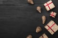 Upper, top view, of Christmas presents on a wooden black rustic background, with space for text. Royalty Free Stock Photo