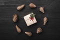 Upper, top view, of Christmas presents on a wooden black rustic background. Royalty Free Stock Photo