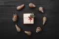 Upper, top view, of Christmas presents on a wooden black rustic background. Royalty Free Stock Photo