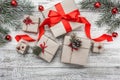 Upper, top view, of Christmas presents on a wooden rustic background, decorated with evergreen branch. Royalty Free Stock Photo
