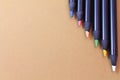 Upper view of artistic polychrome drawing color pencils on beige natural background Royalty Free Stock Photo