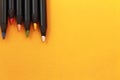 Upper view of artistic polychrome drawing color pencils on yellow background Royalty Free Stock Photo