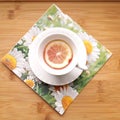 Cute cup of lemon tea on a daisy napkin