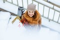 Upper view of smiling elegant female in brown hat and scarf Royalty Free Stock Photo