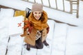 Upper view of smiling elegant woman in brown hat and scarf Royalty Free Stock Photo