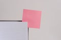 Upper view striped lined hard cover note book blank color sticky note inserted clear background. Reminder important Royalty Free Stock Photo
