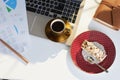 Upper view of table in modern office with piece of cake