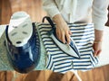 Woman ironing in house in sunny day Royalty Free Stock Photo