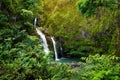 Upper Waikani Falls also known as Three Bears, a trio of large waterfalls amid rocks & lush vegetation with a popular swimming hol