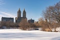 The Upper West Side Skyline seen from the Frozen Lake at Central Park with Snow in New York City Royalty Free Stock Photo