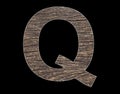 Alphabet letter Q - Rustic tree bark background Royalty Free Stock Photo