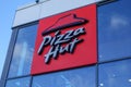 Sign outside Pizza Hut restaurant. American fast food company. Royalty Free Stock Photo