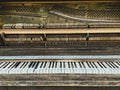 Upright piano keys and exposed hammer rail Royalty Free Stock Photo