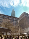 Upright shot of Empire State building seen from ground level.