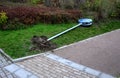 Uprooted blue road sign at the pedestrian zone and cycle path. pedestrian and bicycle symbol. lies upright even with a concrete fo Royalty Free Stock Photo