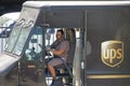 UPS Delivery Driver Wearing a Protective Mask During the COVID-19 Coronavirus Pandemic