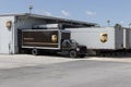 UPS delivery and transport trucks. UPS picks up, transports and delivers packages and parcels from all over the world