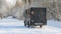 UPS delivery truck on snow covered rural road Royalty Free Stock Photo