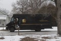 UPS Delivery Truck in the Winter delivering Packages Royalty Free Stock Photo