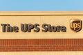 UPS Store sign and logo in a building wall Royalty Free Stock Photo