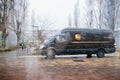 UPS Van on rainy dain delivering mail parcel Royalty Free Stock Photo