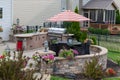 Upscale backyard round brick patio