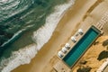 Upscale beachfront home with pool, overhead ocean view.