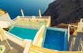 Upscale holiday resort panoramic deck outdoor pools Imerovigli Santorini Greece Royalty Free Stock Photo