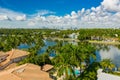 Upscale homes in Miami Beach waterfront with palm trees Royalty Free Stock Photo