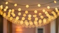 Warm Golden Bokeh Background with Festive String Lights Royalty Free Stock Photo